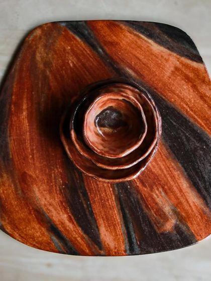 A platter and dip bowl set from a festive collection I'm working on, featuring a wood fired aesthetic achieved through glaze application.