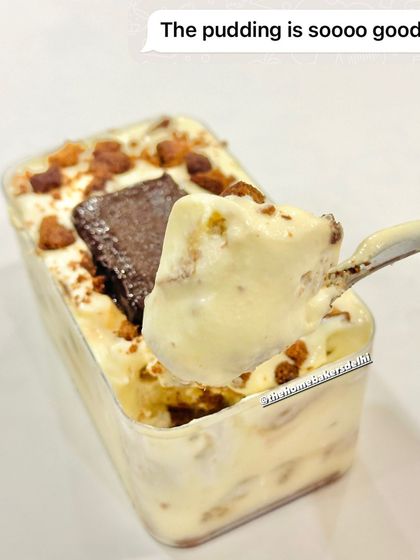 A spoonful of our weekend special, the Parle-G Pudding. This dessert tub features layers of creamy pudding and crushed Parle-G biscuits, a nostalgic treat with a modern twist.