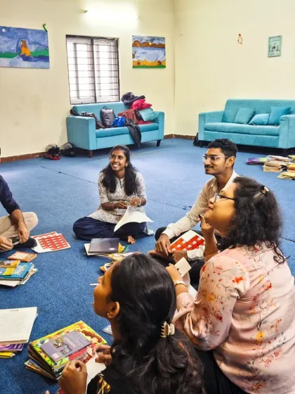 A moment of collaboration and learning. Our team guides volunteers from TATA AMC through our S.T.O.R.Y System, which categorizes books by age and values like courage, kindness, and resilience.