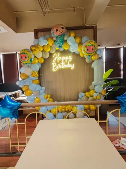 A full view of the Cocomelon birthday setup in a restaurant, showing how I can decorate any space.
