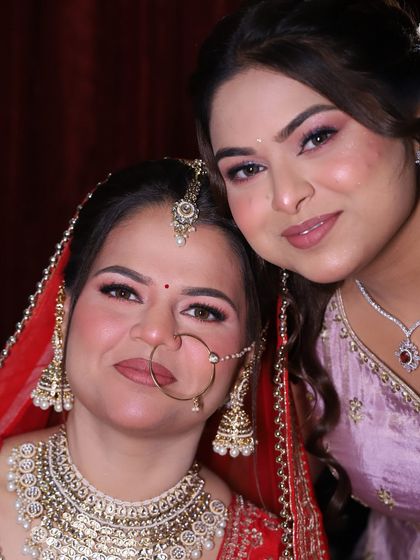 The bride and her sister sharing a happy moment. It's always special to get the bride and her family ready for the big day.