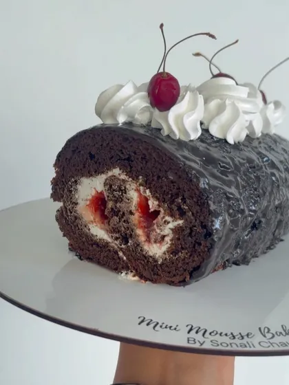 This is my take on the classic Black Forest, reimagined as a Swiss Roll. It features a rich chocolate sponge, rolled with fresh cream and cherries, and finished with a chocolate glaze for a nostalgic treat.