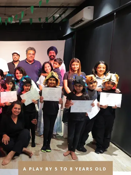 The proud cast and crew of our 5 to 8 year old play, celebrating a successful show with their families.