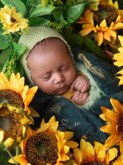 Surrounded by a field of sunflowers, this little one is a ray of sunshine. The overhead angle creates a beautiful, immersive floral portrait.
