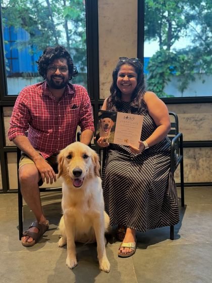 Pixel and her family, all smiles after a successful Board & Train program.