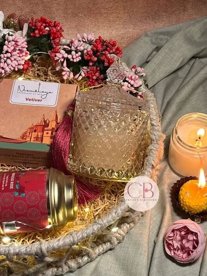 Our exclusive Diwali hampers are crafted with love for your work family. This jute basket features a beautiful glass candle jar, a copper tumbler, and other festive goodies.