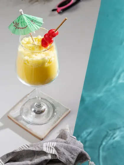 Time for a poolside drink? This Pina Colada gel candle looks just like the frosty cocktail, complete with a little umbrella and cherries.