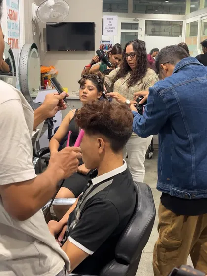 A behind-the-scenes shot from a portfolio shoot, capturing the energy and creativity of our students and models.