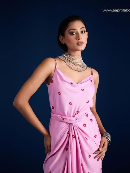 A portrait focusing on the cowl neck and print detail of the Aapro Adila Wrap Dress.