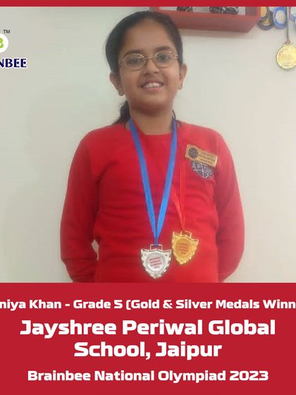 Haniya Khan from Jayshree Periwal Global School, Jaipur, proudly displays her Gold and Silver medals from the 2023 competition.