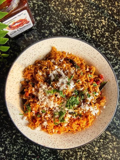 A comforting bowl of Puliyogare, also known as tamarind rice. This South Indian classic gets its signature tangy taste from tamarind, and my Imli Chutney makes preparing it at home simple and delicious.
