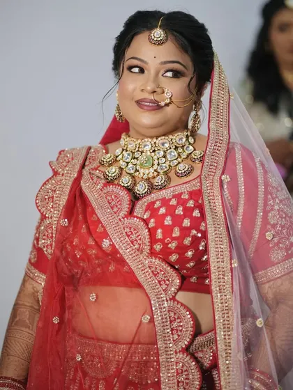 A happy, candid moment of the bride. Her natural smile is the best accessory to the complete bridal styling.