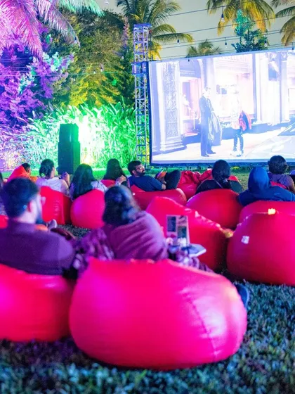 The view from the back of our open-air cinema. It's a full house of guests enjoying a movie under the palm trees.