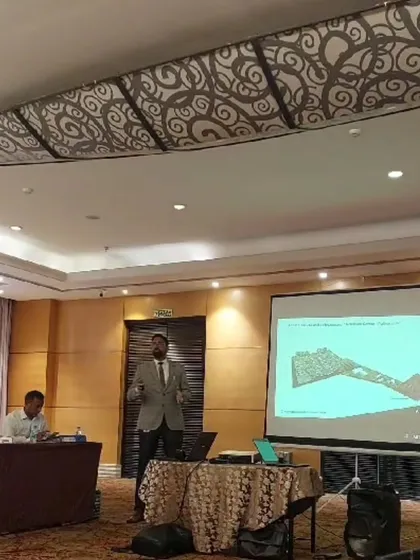 A duplicate of 51, showing me presenting a master plan.