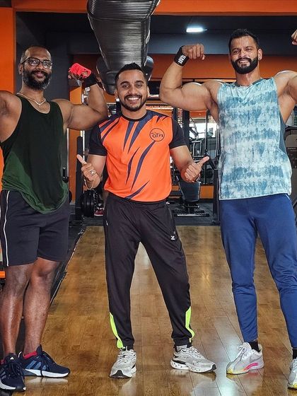 Surrounded by strength and motivation. Posing with fellow fitness enthusiasts at OxFit Gym after a great workout.