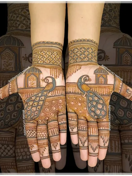 Two majestic peacocks stand before traditional jharokhas in this beautiful palm design. It's a classic and regal choice for any bride.