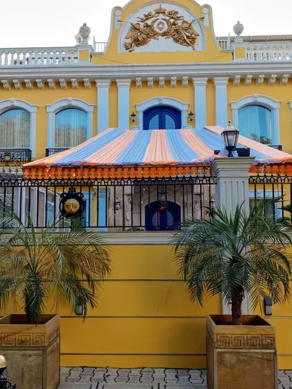 We can install large canopy tents even in front of grand residences. This striped orange and blue tent was set up for a get-together in DLF Phase 1, providing shade and a designated party zone.