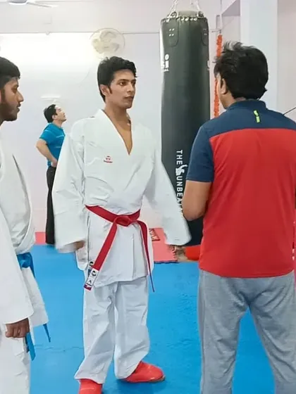 Instructors discussing techniques with Pranay Sharma during the seminar. We believe in constantly upgrading our own skills as coaches.