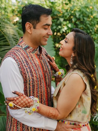 The couple's chemistry is what makes a wedding special. This photo from a Haldi shoot captures their joyful interaction and the beautiful connection they share.