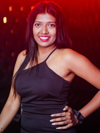 A guest posing at the bar.