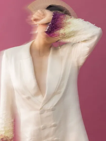Using motion blur, I captured a sense of dynamic energy in this shot. The styling pairs a structured, double-breasted blazer with unique gradient sleeve embellishments, creating a narrative of avant-garde sophistication and artistic expression.