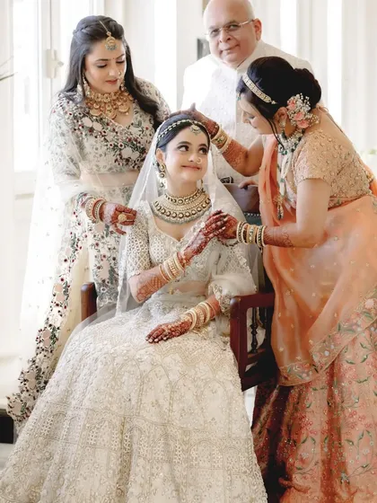The bride being blessed and adorned by the women in her family. A beautiful portrait of love spanning generations.
