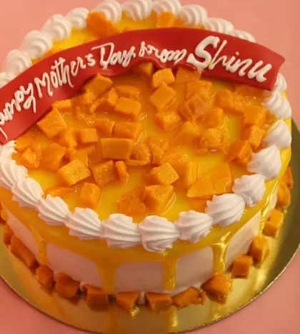 A special Mango Cake for Mother's Day, topped with a generous amount of diced mango and a loving message.