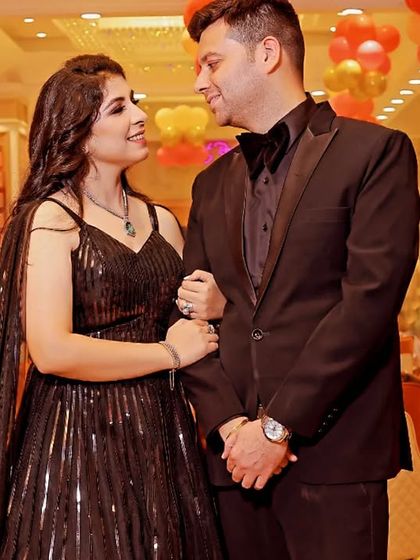 A lovely candid photo of the parents during their daughter's birthday party.