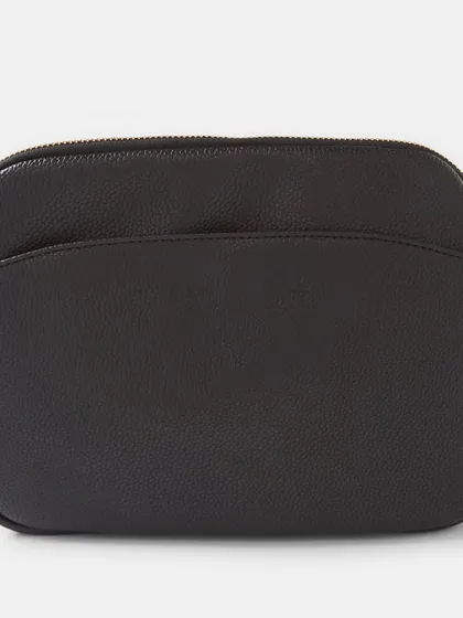 The back view of the black Australia Crossbody bag. It has a clean, simple look with rose gold hardware.