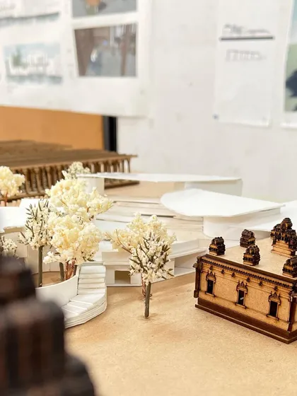 A close-up of the architectural model. Creating these tiny trees and structures requires a lot of patience and a steady hand, skills I use every day in my artwork.