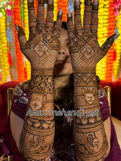 A closer look at the intricate details in a bridal design. Notice the fine lines and shading used to create depth in the elephants and jaali patterns.