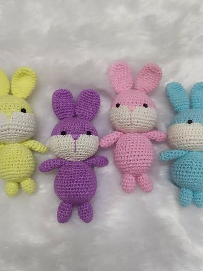 A colorful lineup of crochet bunnies, made to order. These simple, cute toys are loaded with lots of love and can be customized in any color you like.