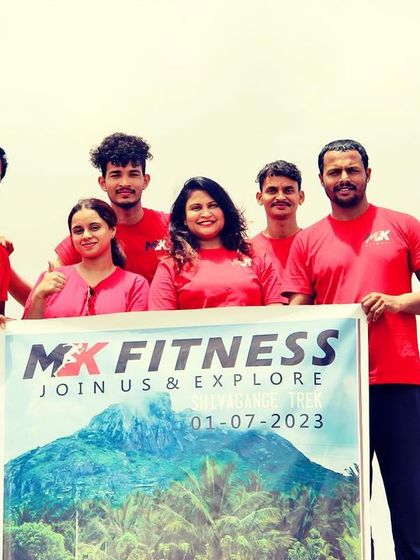 A smaller team from a fitness club trek, holding our banner high. I often collaborate with groups and clubs to create custom trekking experiences.