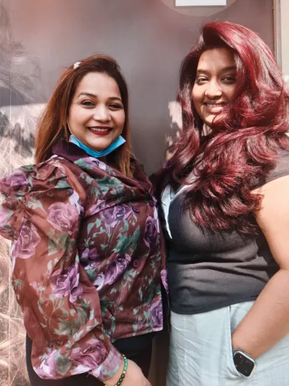 Me with a happy client, both of us loving her new fiery red hair. Building relationships with our clients is the best part of my job.