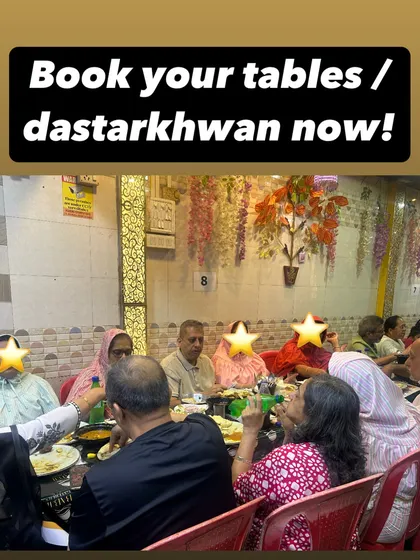 You can book either tables or a full Dastarkhwan for your Iftar gatherings. This image shows a family enjoying their meal at a table, with all the dishes served for easy sharing.
