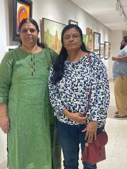 With a friend at the exhibition, enjoying the diverse collection of artworks.