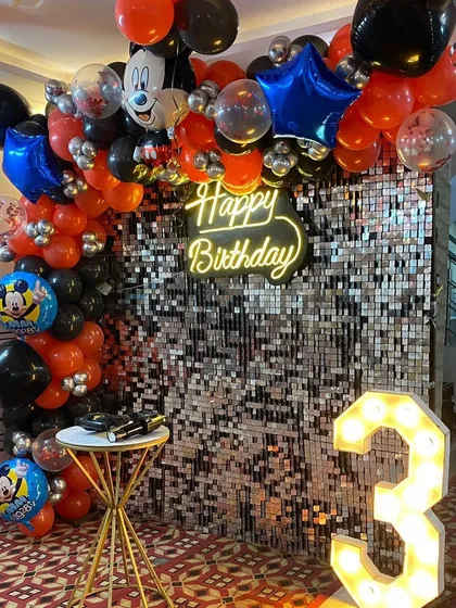 A detailed shot of the balloon arch with Mickey Mouse elements for a fun and festive birthday party.