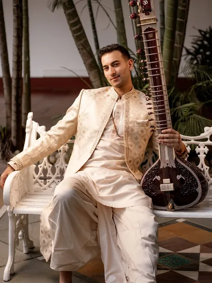 Announcing my India tour in a classic cream and gold ensemble. This look is timeless and elegant, reflecting the classical roots of my music.