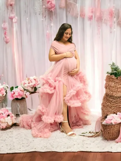 This is a great example of the soft, romantic sets I can build in my studio. The mom-to-be is surrounded by pink flowers and gentle lighting, wearing a beautiful ruffled gown that’s part of my collection.