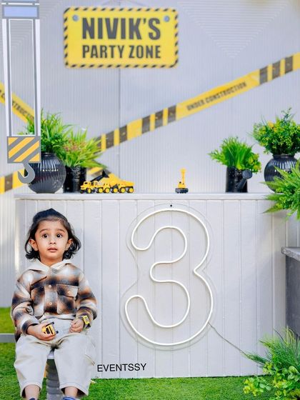 The birthday boy enjoying his construction-themed party. Creating a space where the child of honor can interact with the decor is a key part of my design philosophy.