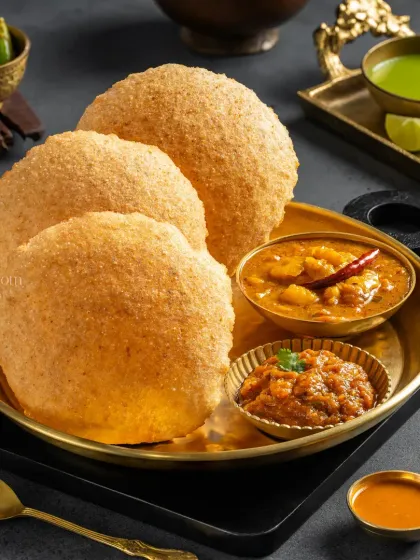 Another beautiful shot of Puri Sabzi for Jain Sweets, served in traditional brassware.