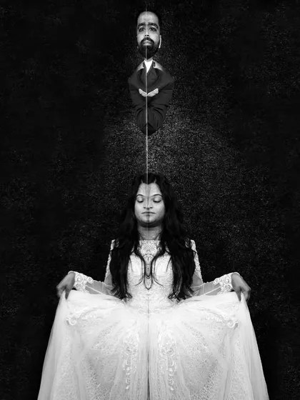 Another fun, experimental portrait. This black and white composition plays with reflection and symmetry to create a surreal and thought-provoking image of the couple.