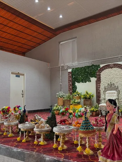 An angled view of the stage and offering table for the home ceremony.