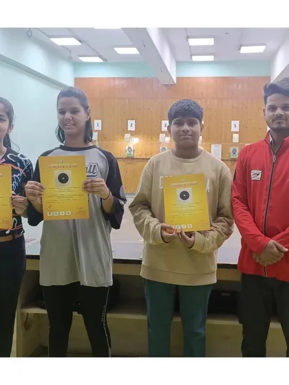 Four campers holding their completion certificates. I ensure every participant is recognized for their effort and participation.