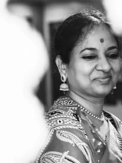 A slightly different angle in black and white, capturing a soft, happy expression. Even in a busy event, I look for these quiet, individual moments that reveal so much personality.