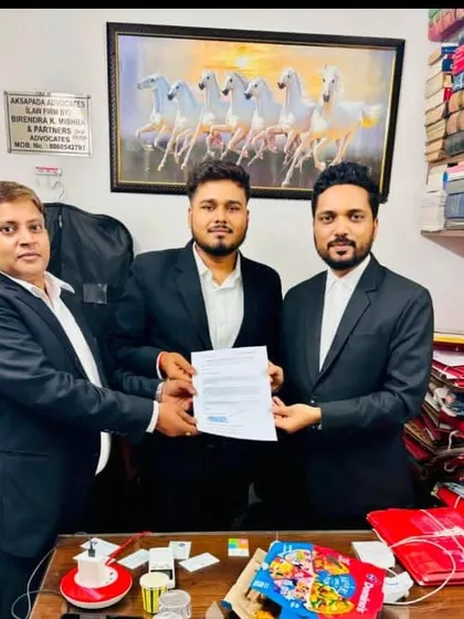 Congratulating another bright intern on the successful completion of his training. Mentorship is a core value of my practice, and I am proud to contribute to the practical education of law students.