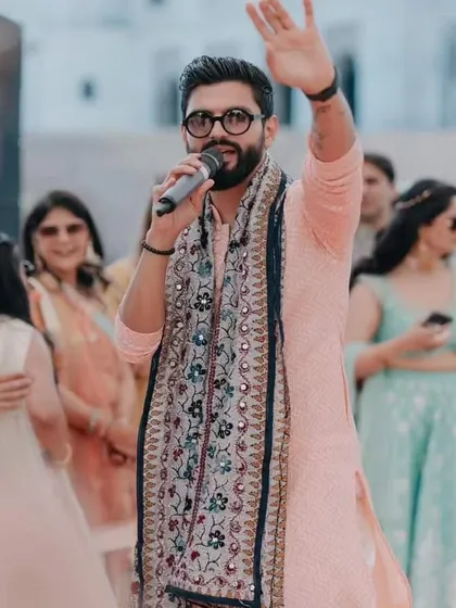 Waving to the crowd, ready to get the party started in my stylish ethnic wear.