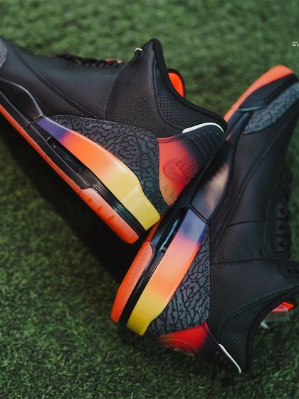 An artistic shot capturing the unique silhouette and colorful heel accents of the Jordan 3 J Balvin 'Rio'.