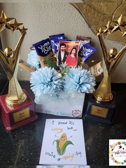 The trophy and bouquet combo shown with a fun, punny greeting card that adds a personal touch.