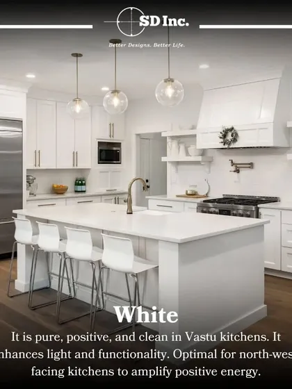 According to Vastu, white is a perfect color for kitchens as it enhances light and positive energy. This all-white kitchen with an island is a beautiful example of a clean, pure, and functional design.